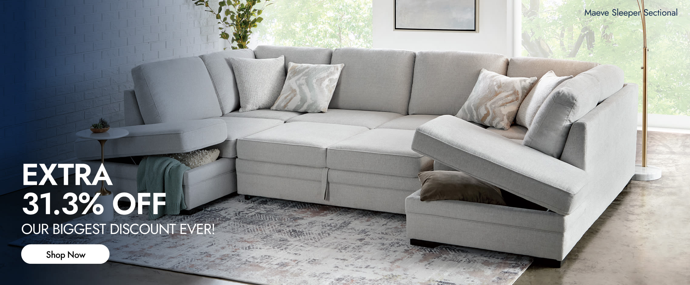 A light gray storage sectional couch with the attached ottoman open showing storage within.