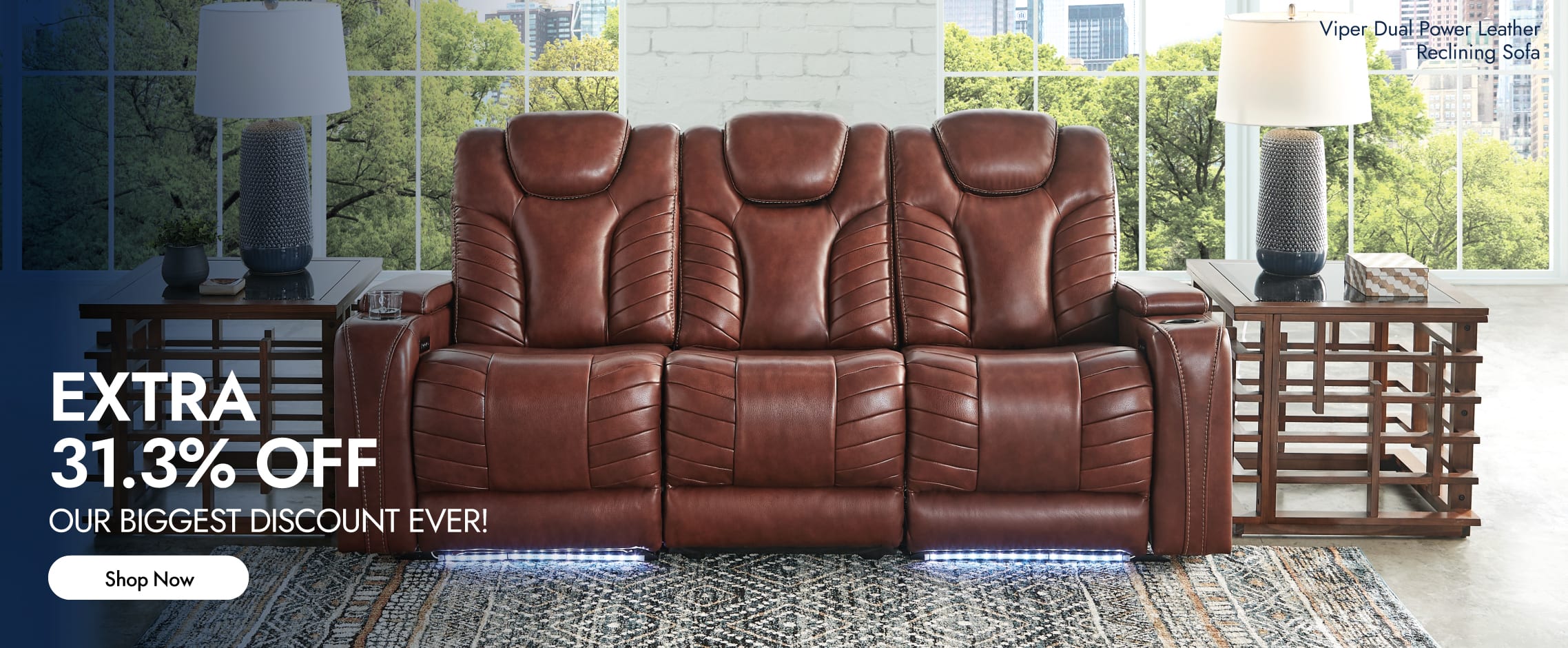 A brown leather reclining sofa with two brown wooden side tables in a living room.