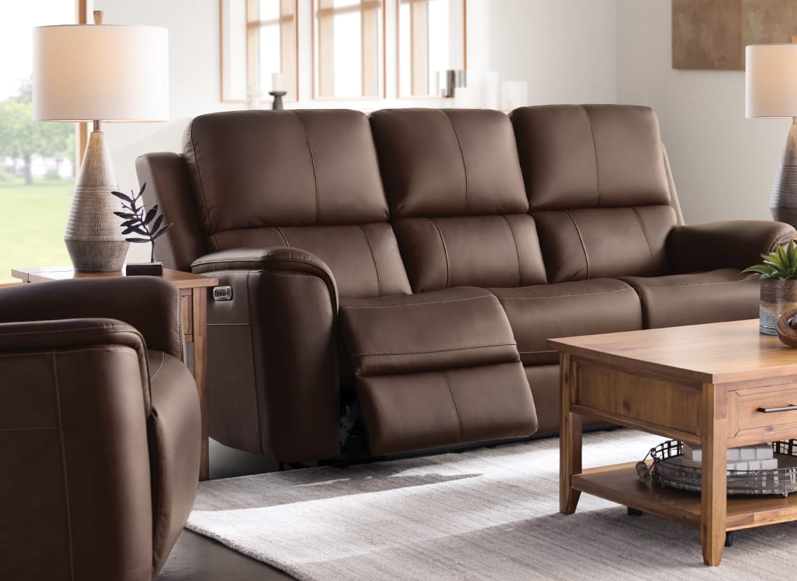 Brown reclining sofa in a living room.