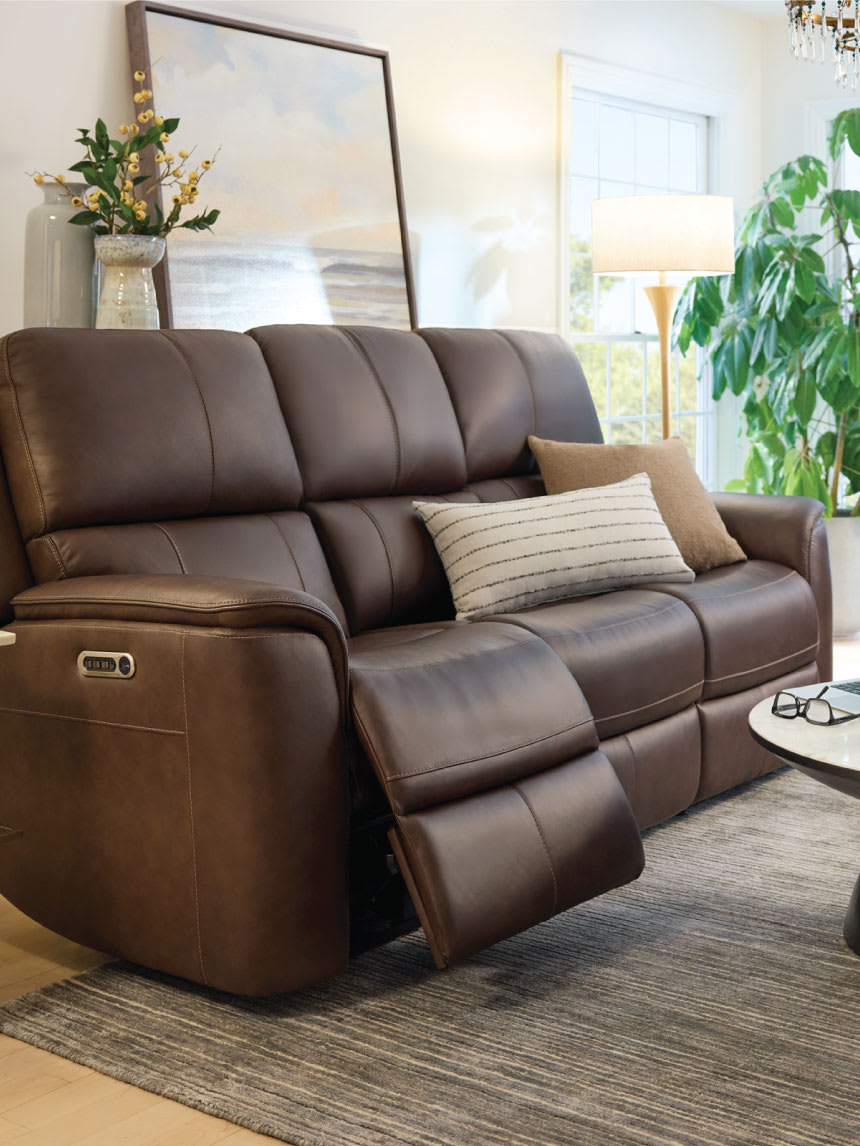 Brown leather power reclining sofas in a living room.