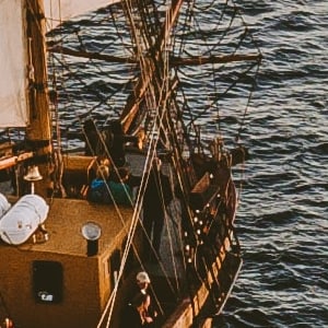 Drone photo of a Pirate ship with a US flag by Austin Neill from Unsplash.