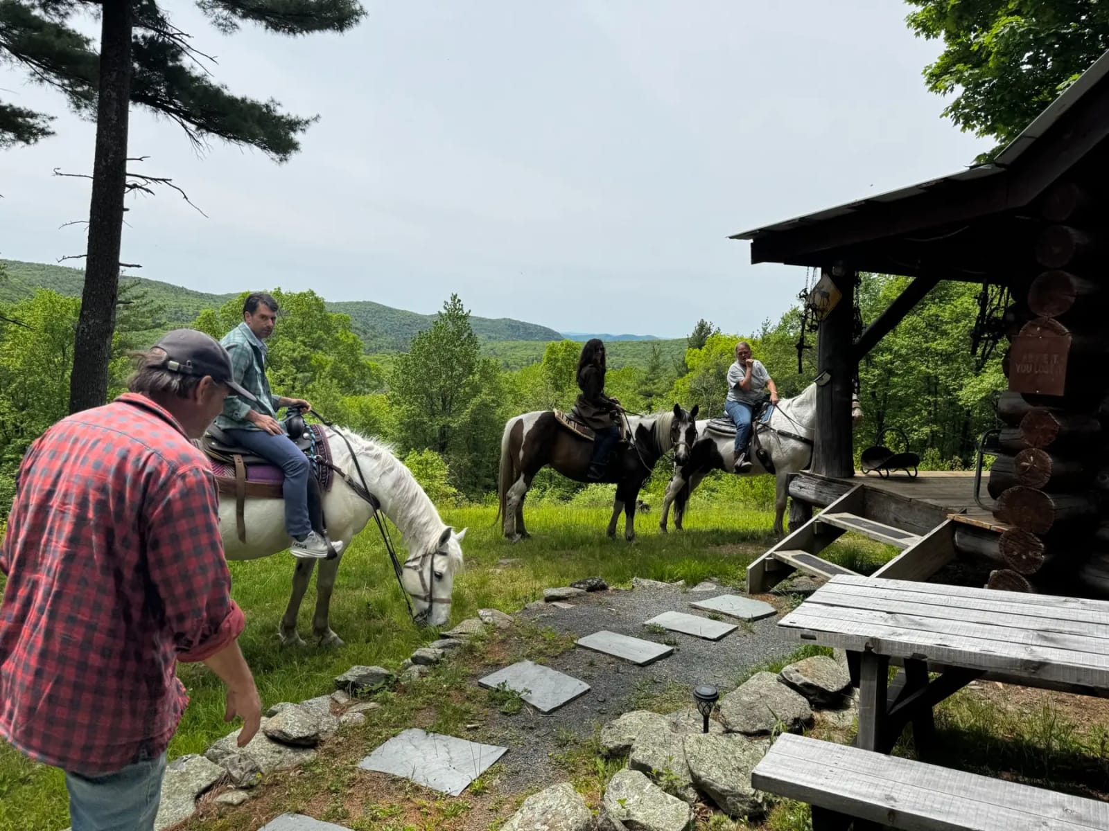 Horses and guests beside the OTP Ranch mountain cabin