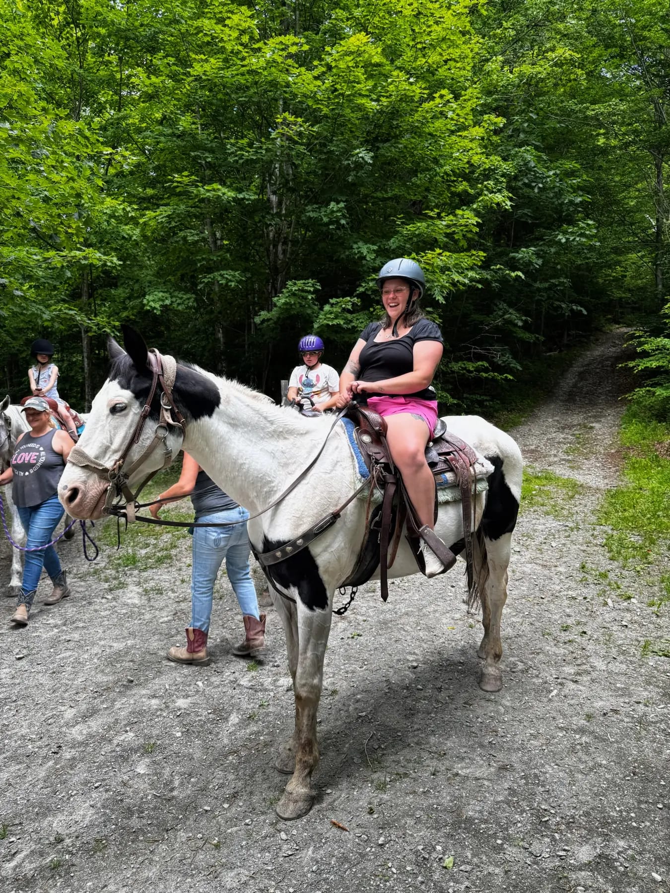 Guests preparing for a guided trail ride at OTP Ranch