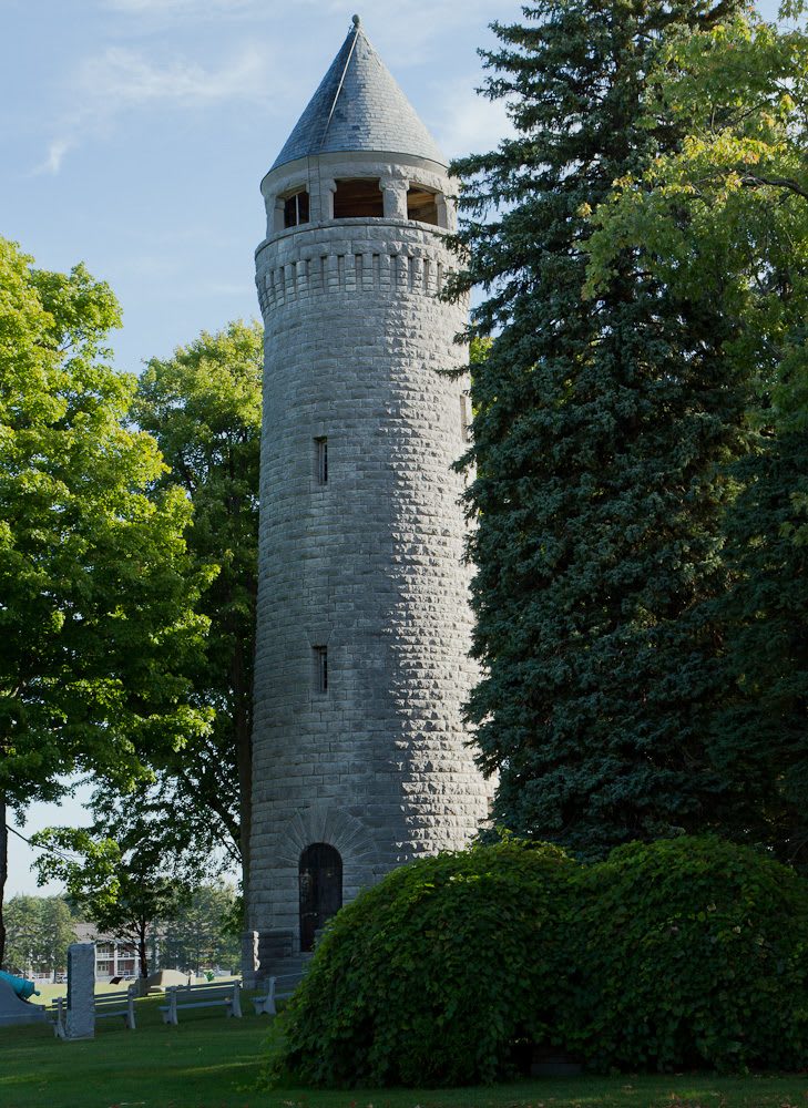 The stone water tower at Madison Barracks, part of the historic district's 86 contributing buildings