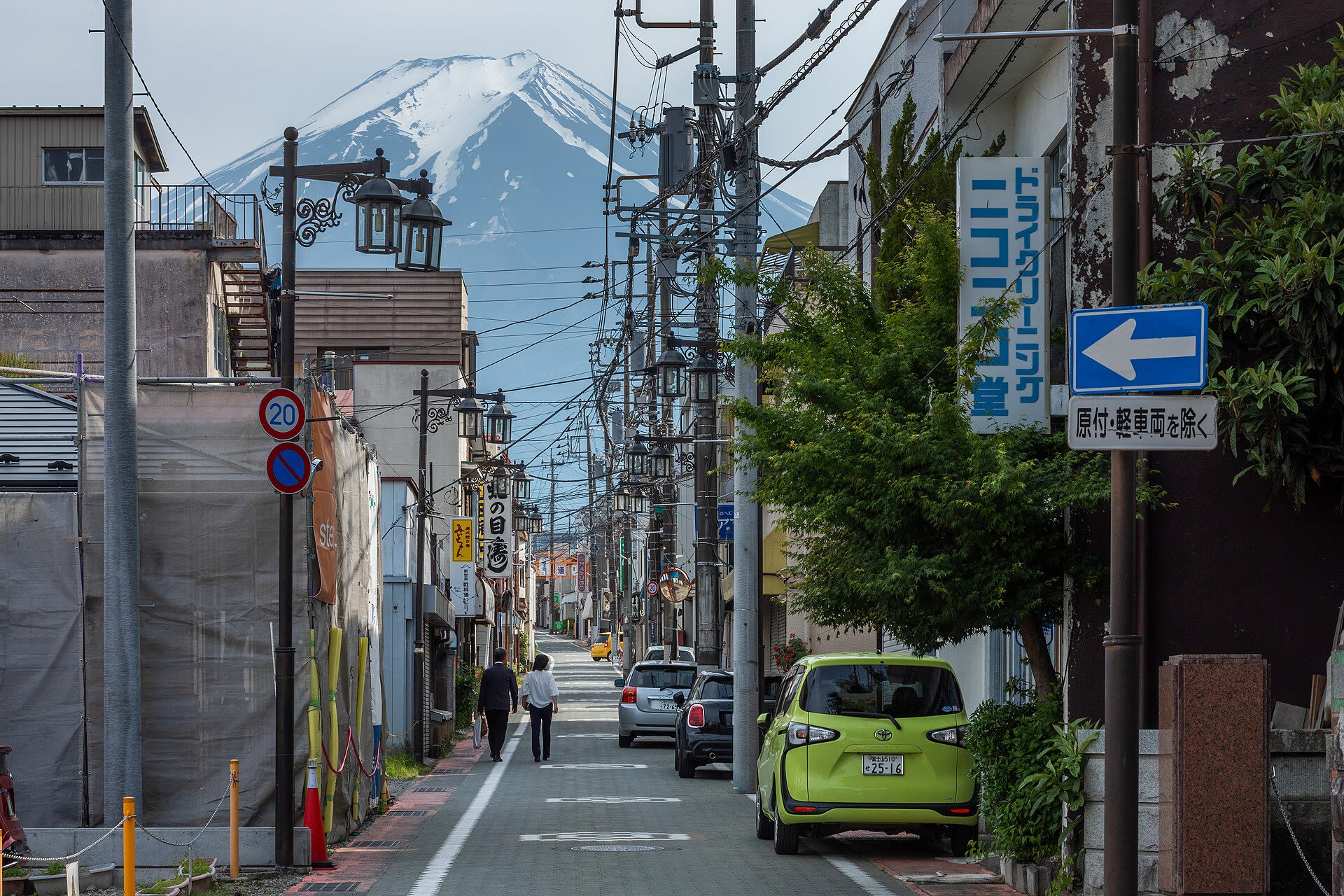 A Shimoyoshida street lined with shops leading toward Mount Fuji