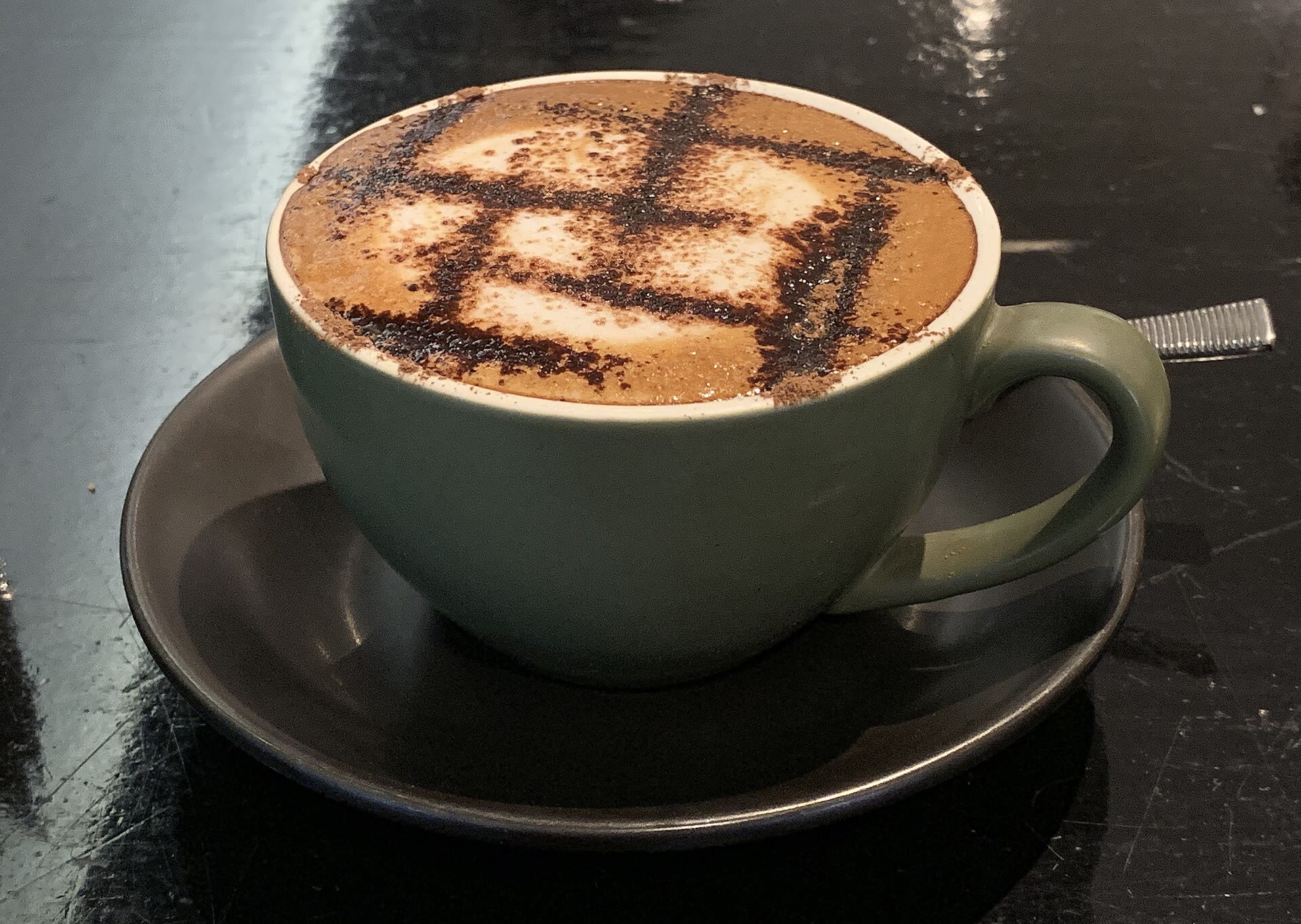 Coffee with latte art at a cafe