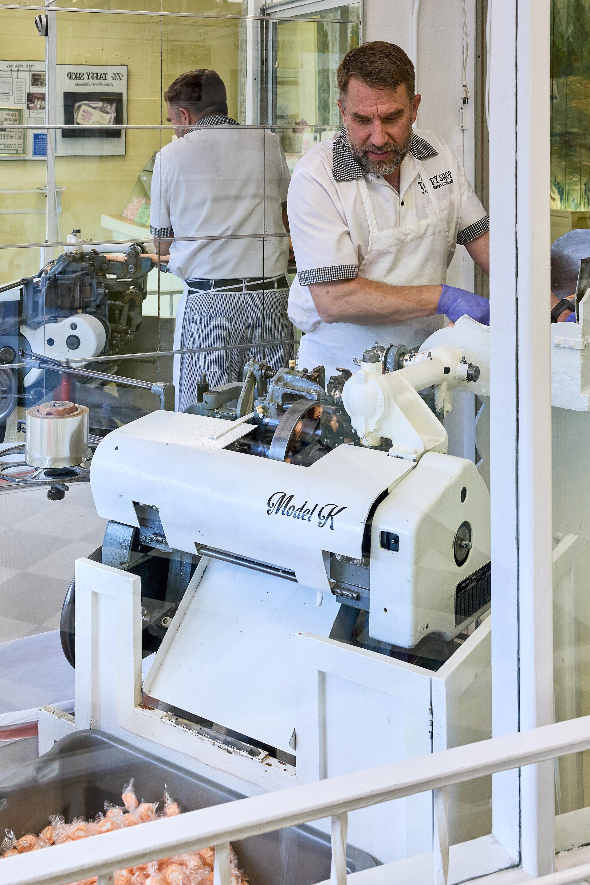 Taffy being wrapped on a vintage Model K machine at the Taffy Shop in Estes Park