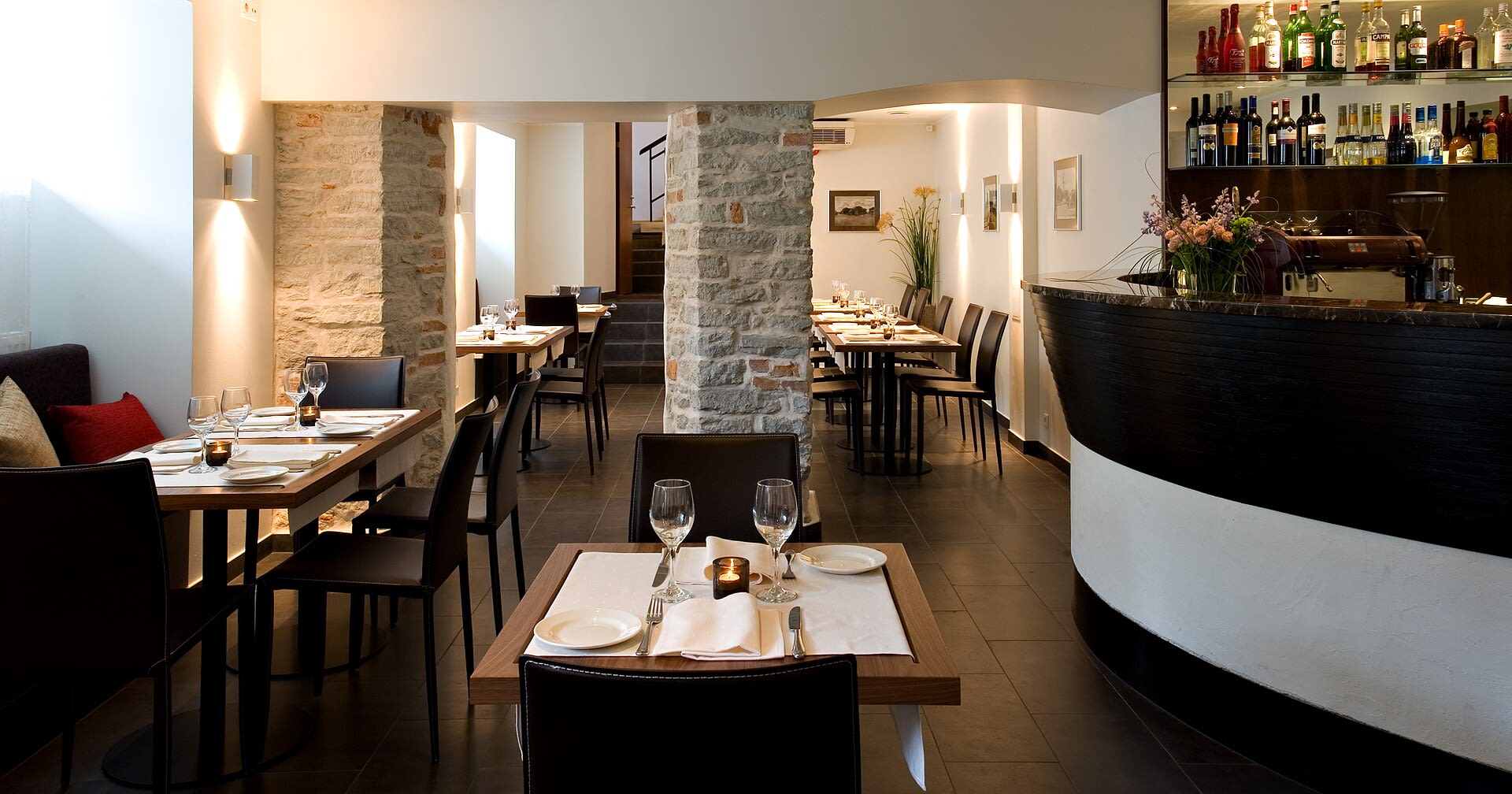 Elegant brasserie restaurant interior with bar seating