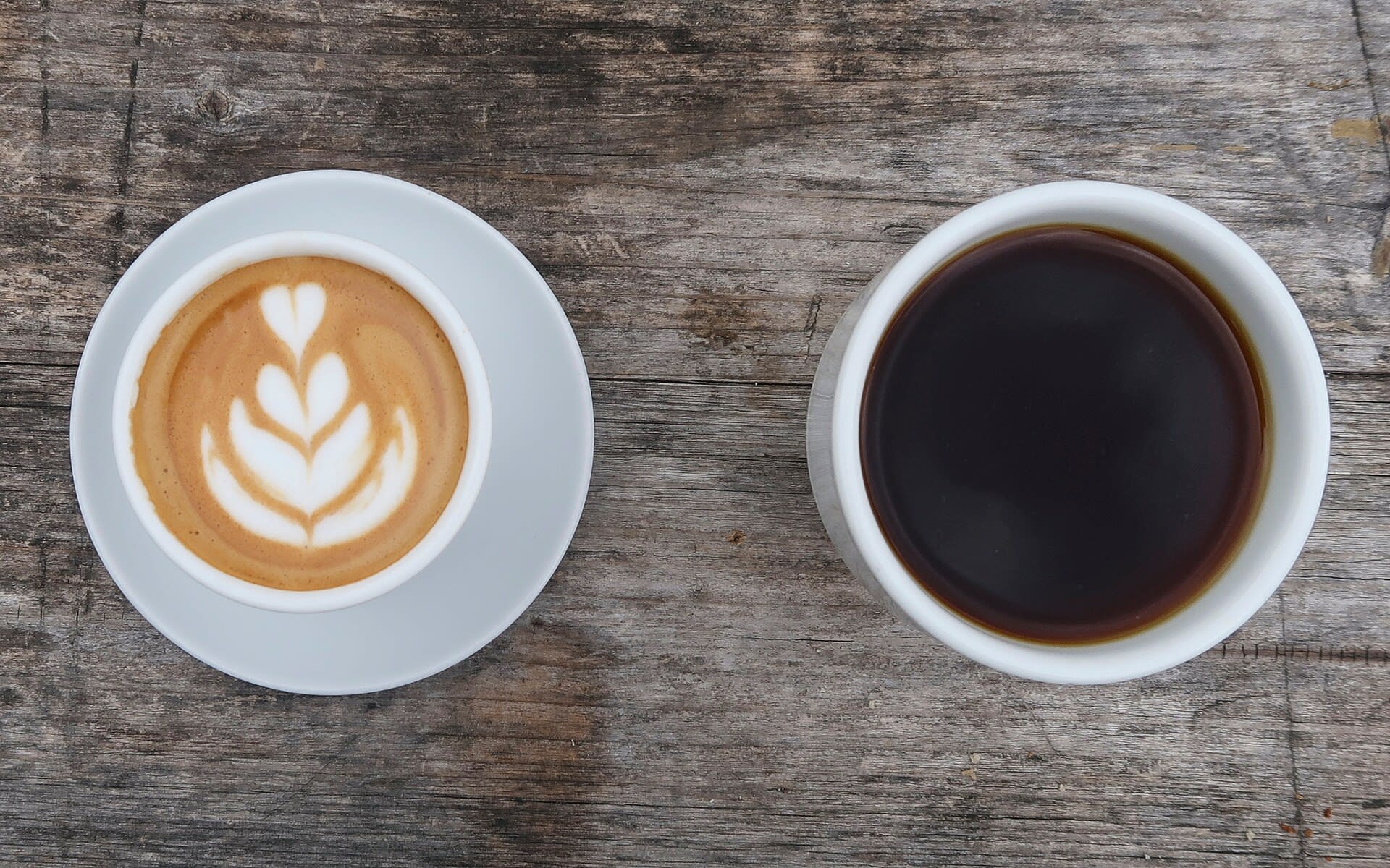 Latte and dark coffee served at a cafe