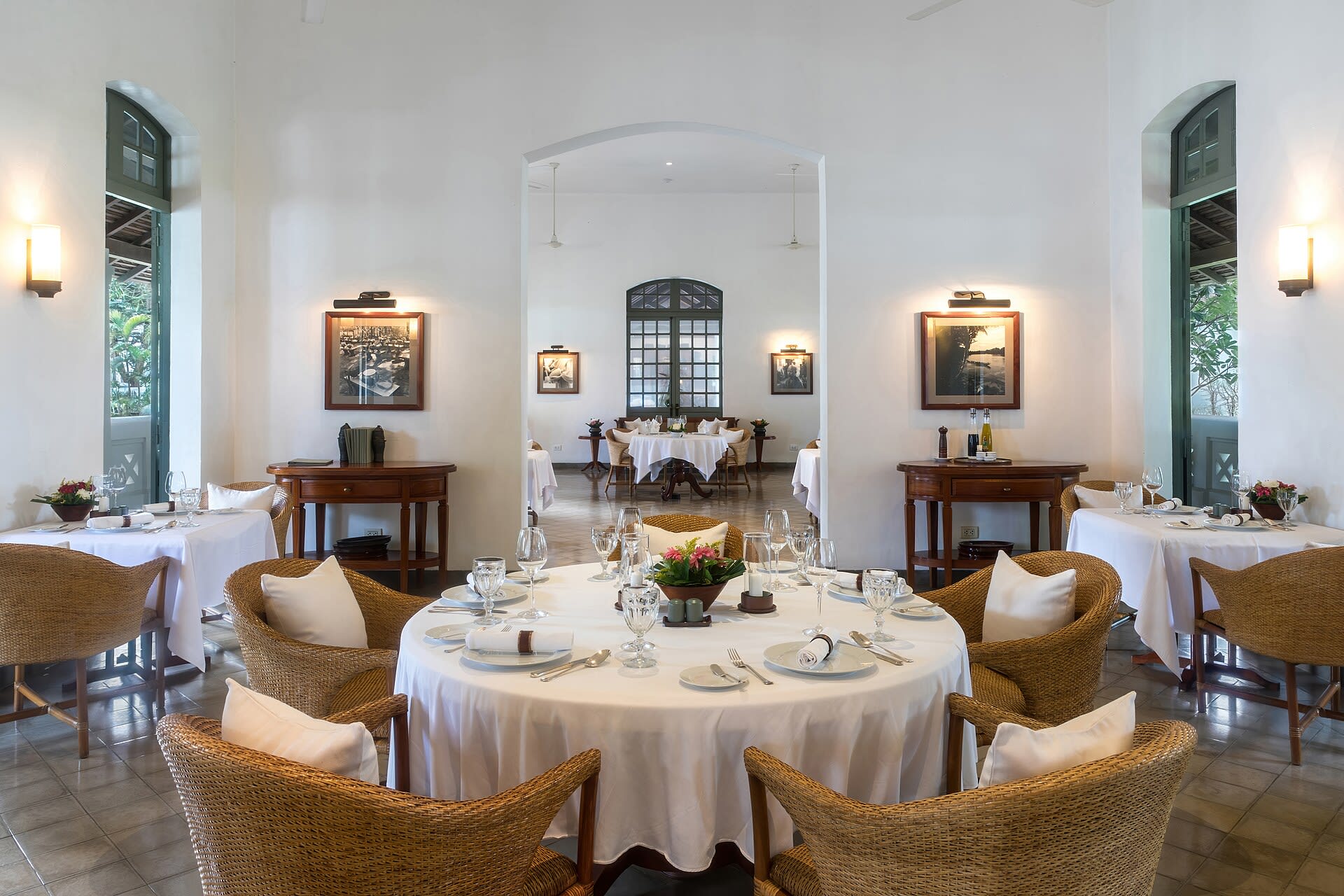 Elegant restaurant dining room with tables set for dinner