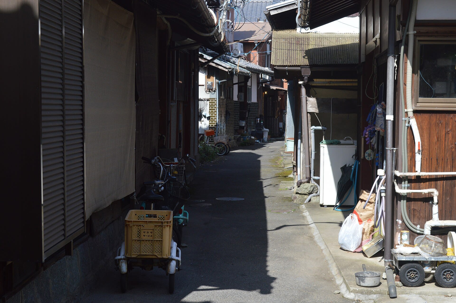 Narrow alley between traditional houses in the car-free village of Okishima