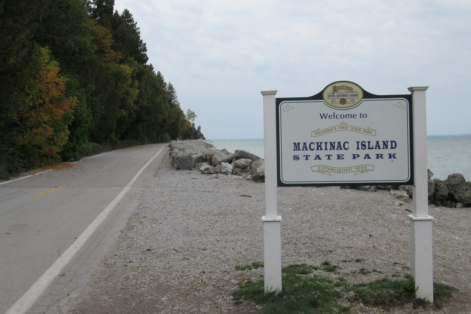 Welcome sign for Mackinac Island State Park along the shoreline, established 1895
