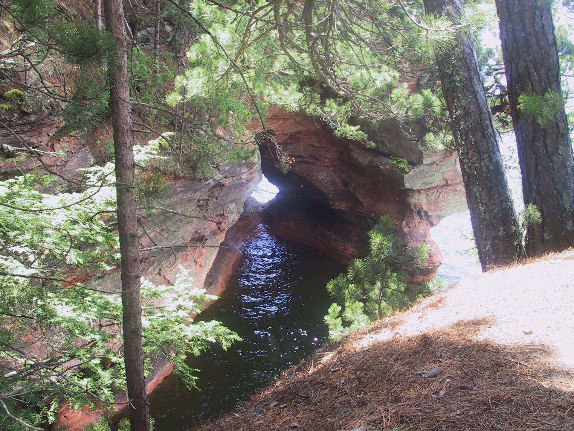Sandstone sea cave carved into the Lake Superior shoreline