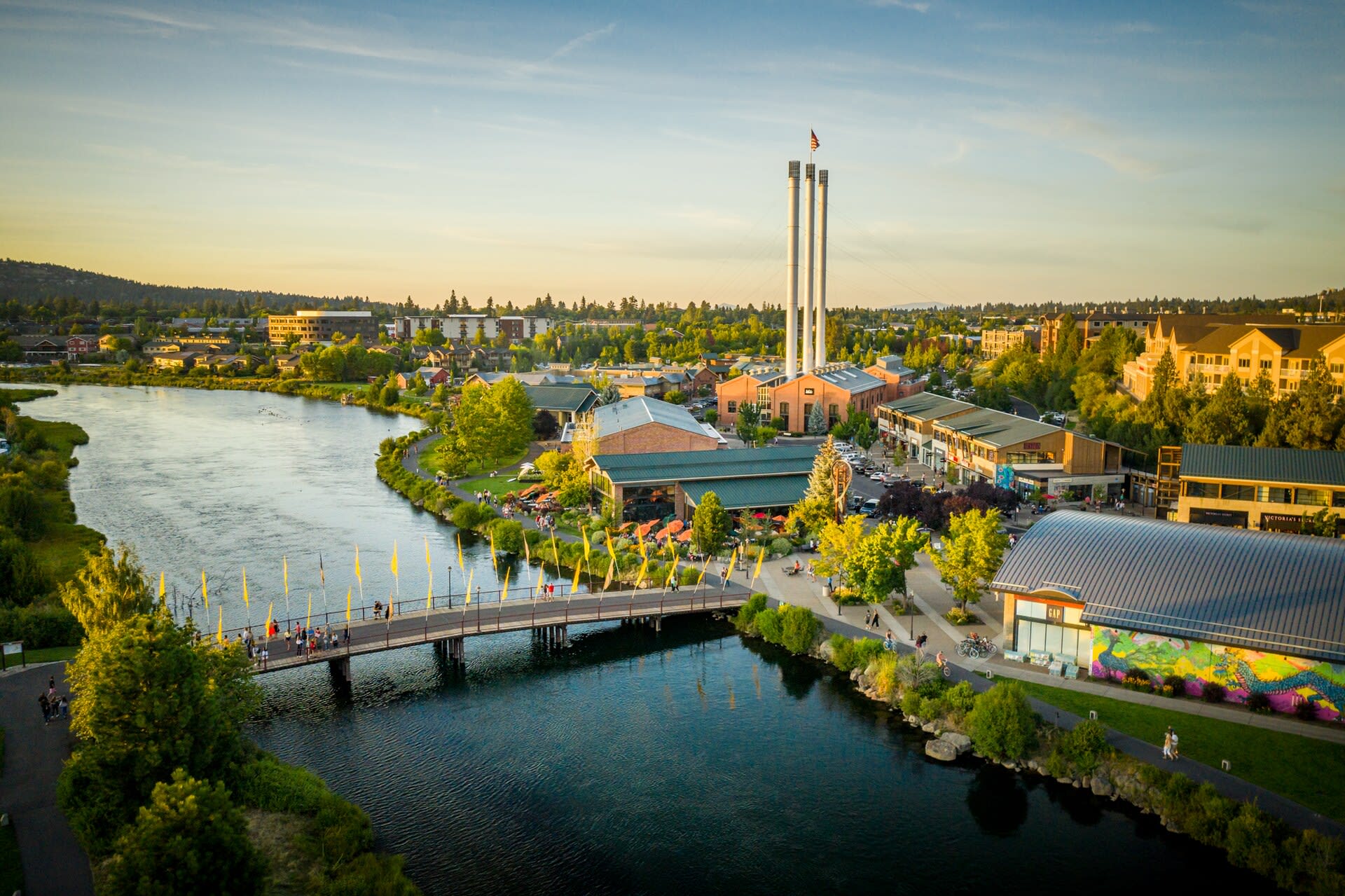 The Old Mill District along the Deschutes River in Bend, redeveloped around its historic sawmill smokestacks