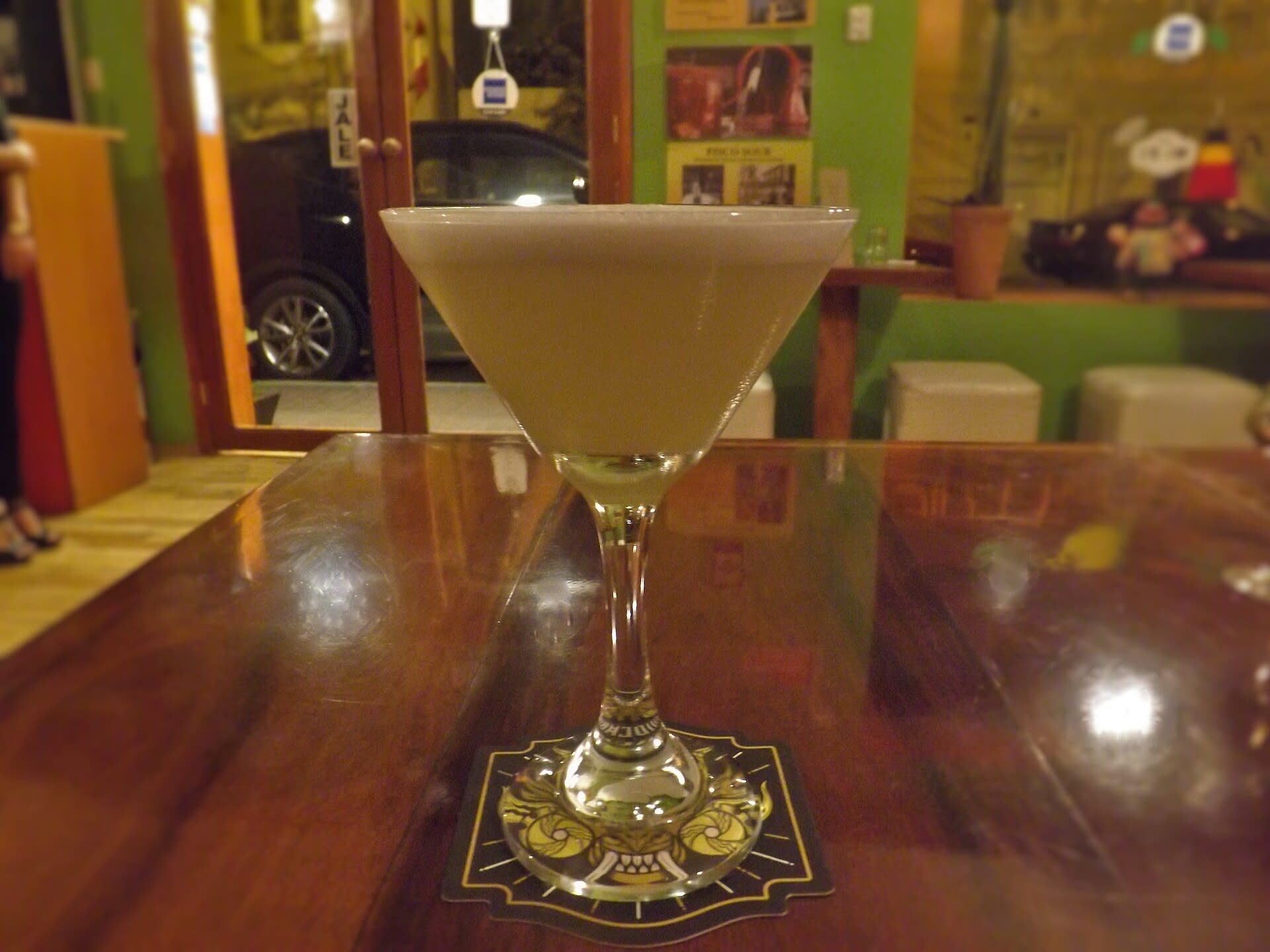 Pisco sour cocktail served in a bar in Lima, Peru