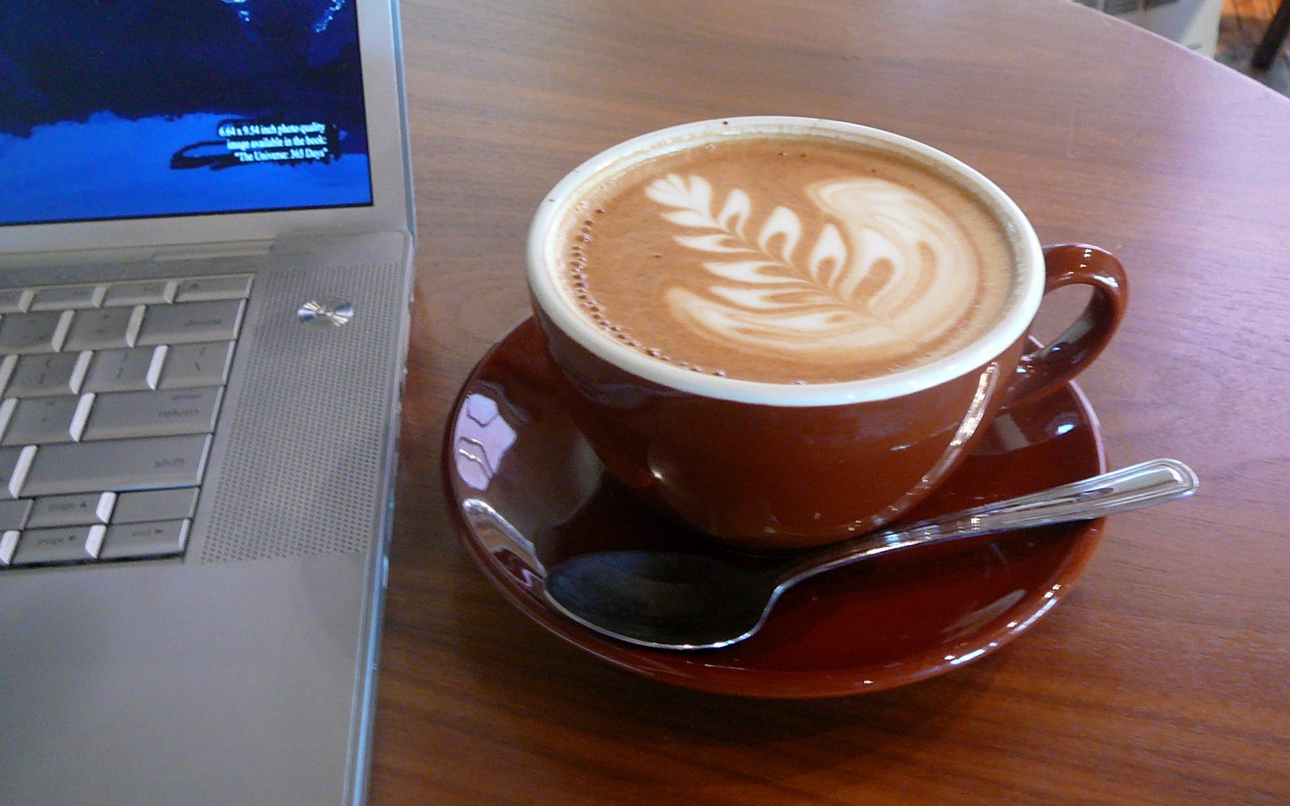Latte with latte art served at a coffee shop