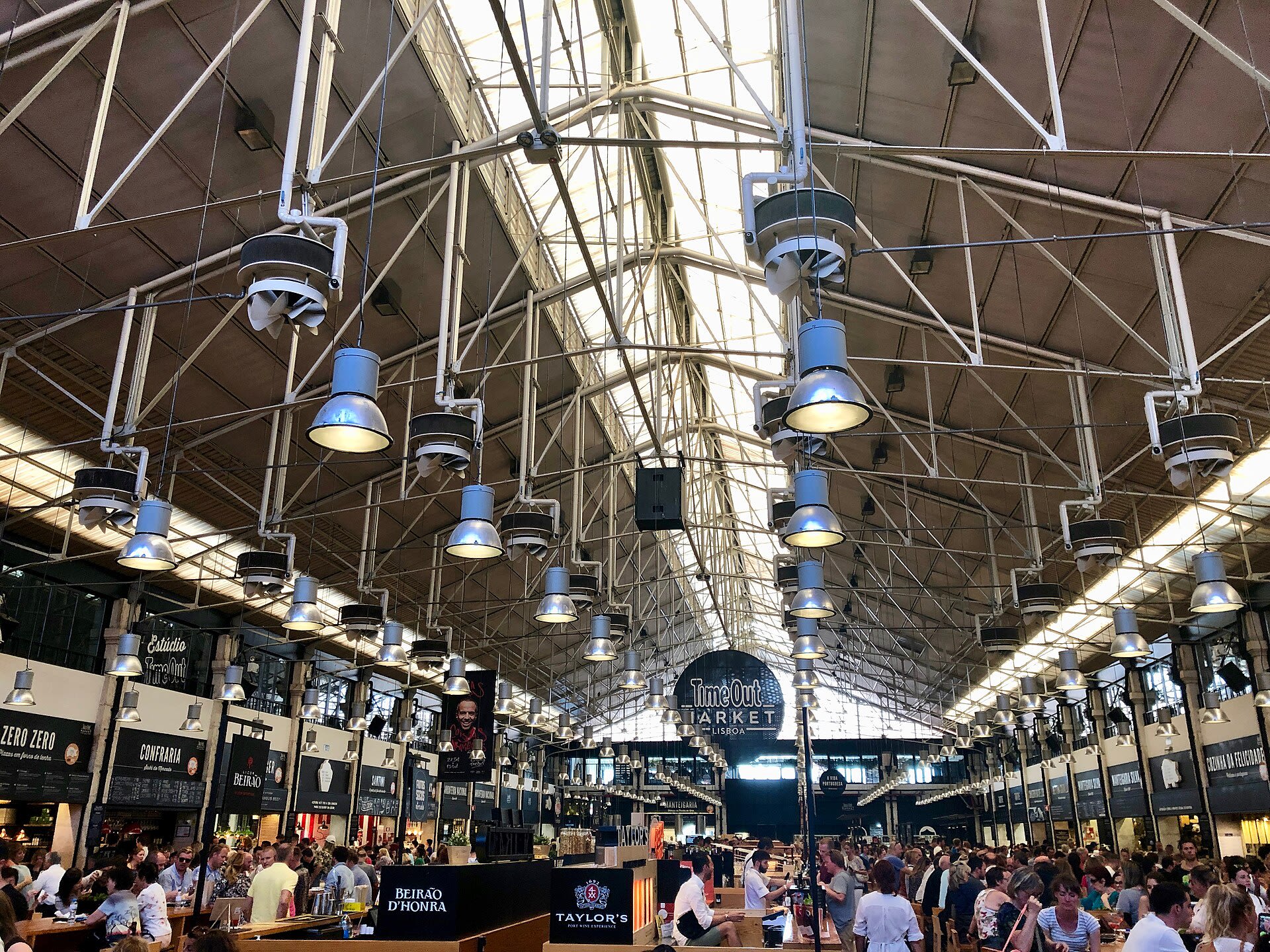 Food stalls inside the Time Out Market at Mercado da Ribeira in Lisbon