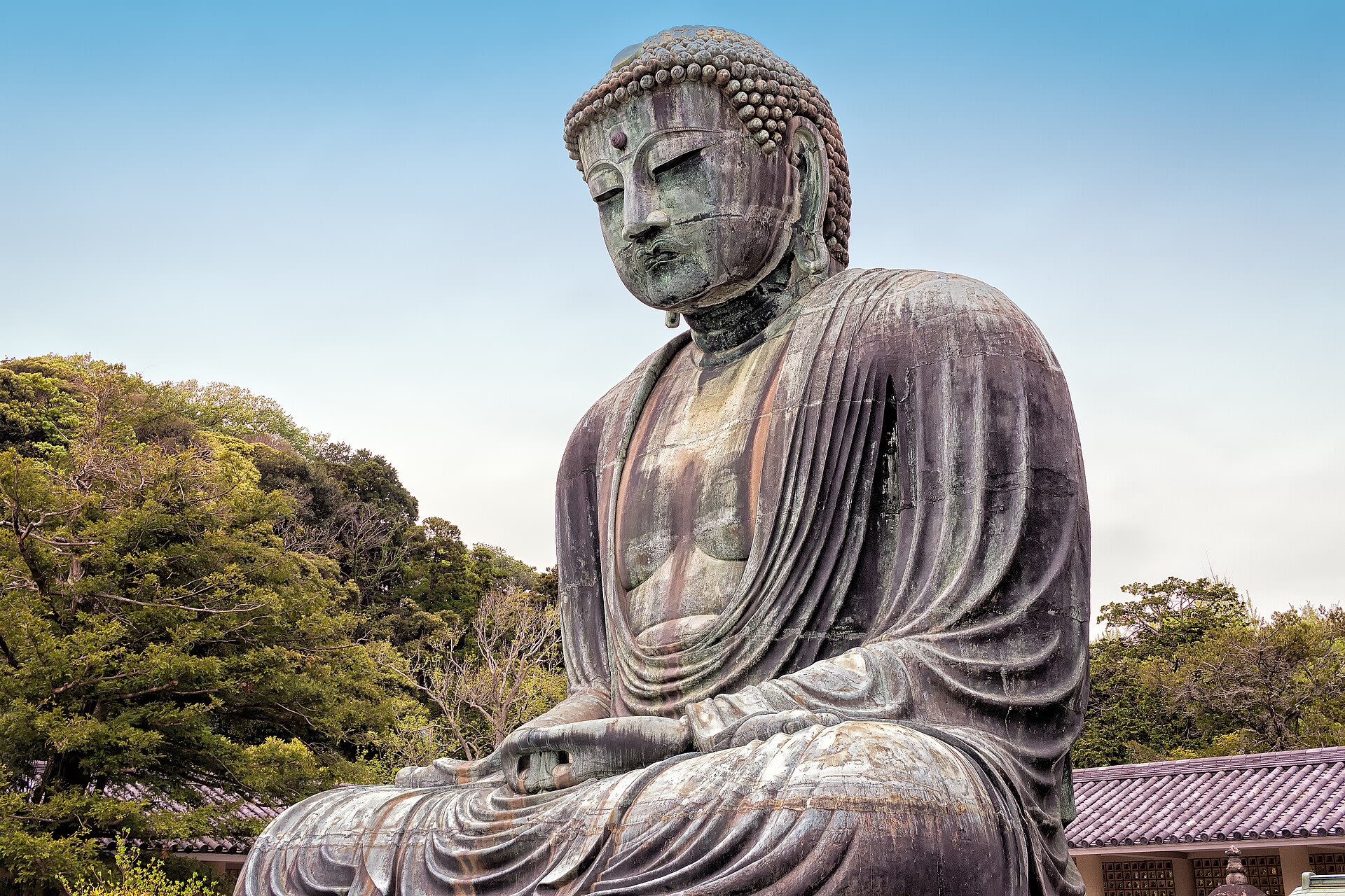 The 13-meter bronze Great Buddha standing outdoors at Kotoku-in