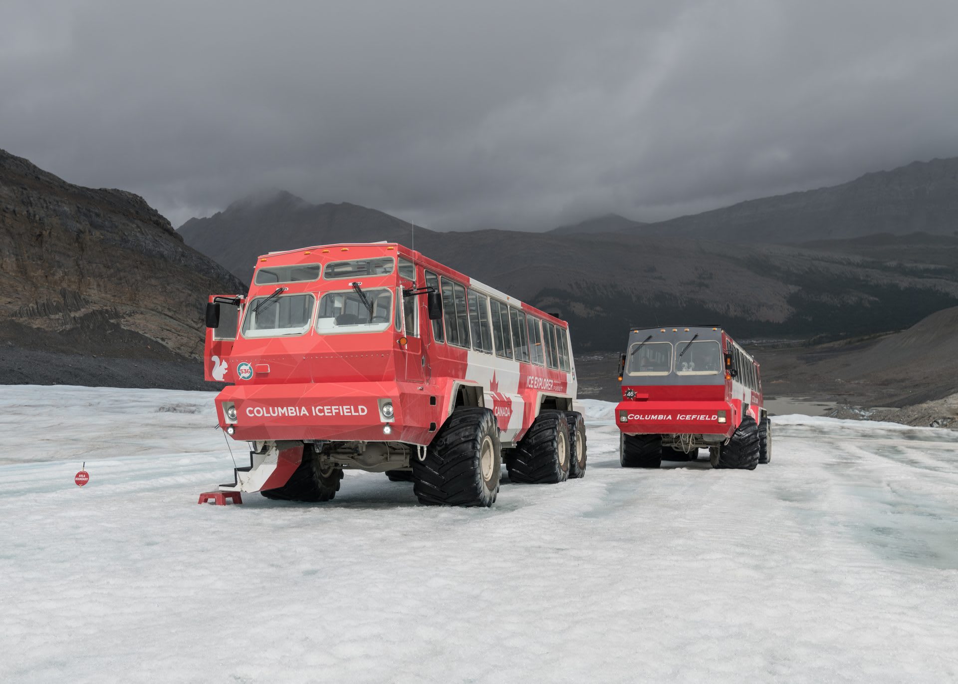 Ice Explorer all-terrain vehicles parked on the Athabasca Glacier in the Columbia Icefield, Jasper National Park