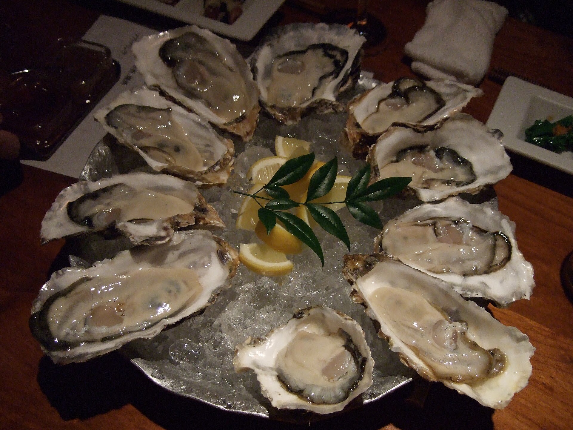 Fresh oysters on ice at a raw bar