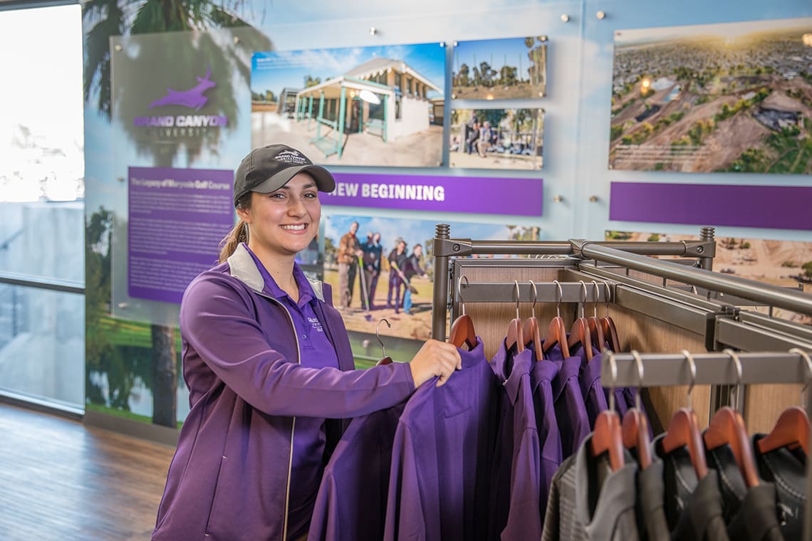 Woman stocking GCU Golf Course Apparel 