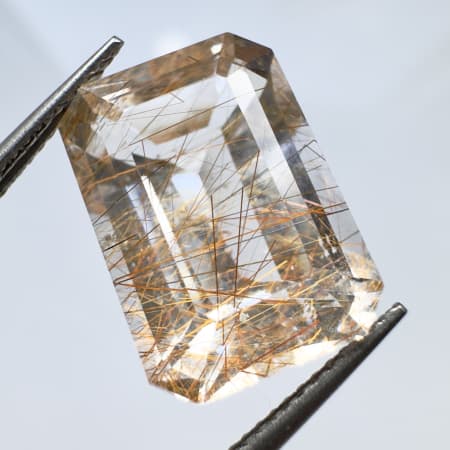 Quartz avec inclusions rutile rouge et dor&eacute;, octogonal, Pakistan, 15 x 10 x 8 mm, 11.03 ct