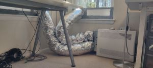 A reader of this article sent me this picture of his window ERV setup