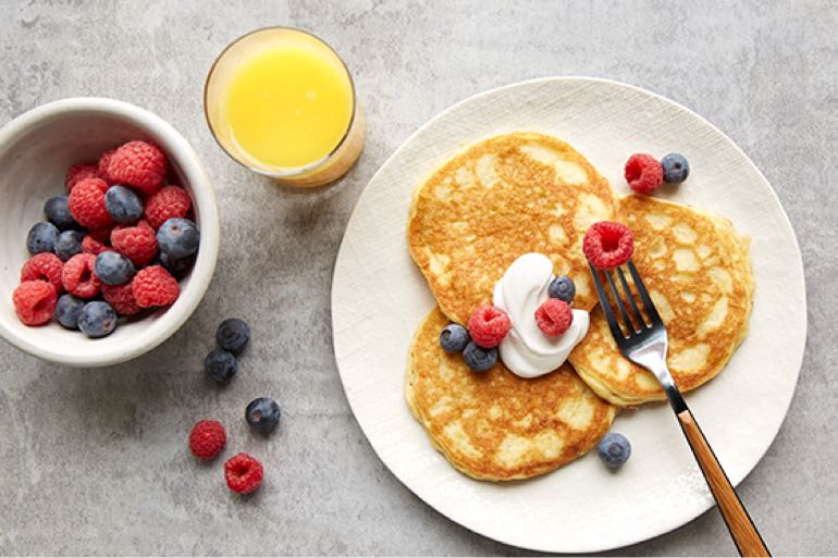 Pancakes and fruit on a table