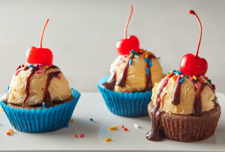 3 brownie cup sundaes topped with cherries