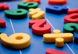 Colorful individual letters and numbers on a table