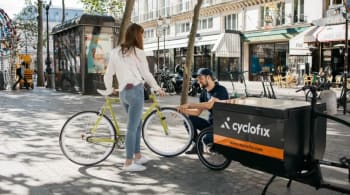 A person riding a bicycle on a city street