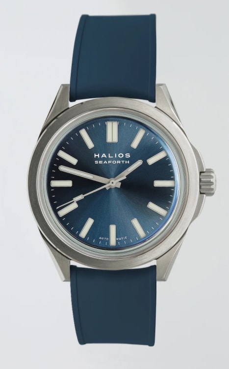 A close-up of a Halios Seaforth watch with a deep blue dial and stainless steel bracelet.