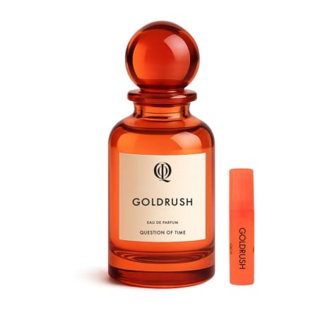 QOT Eau de Parfum (Goldrush), bärnstensfärgad glasflaska med sfäriskt lock, plus liten orange sprayprovflaska
