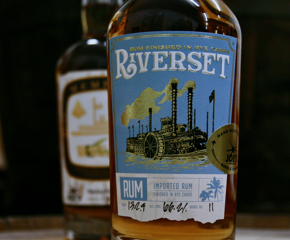 Riverset Rum bottles sitting on a barrel