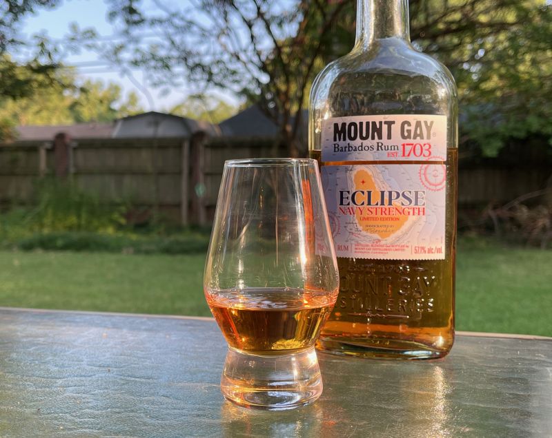 A bottle of Mount Gay Eclipse Navy Strength next to a glass of rum