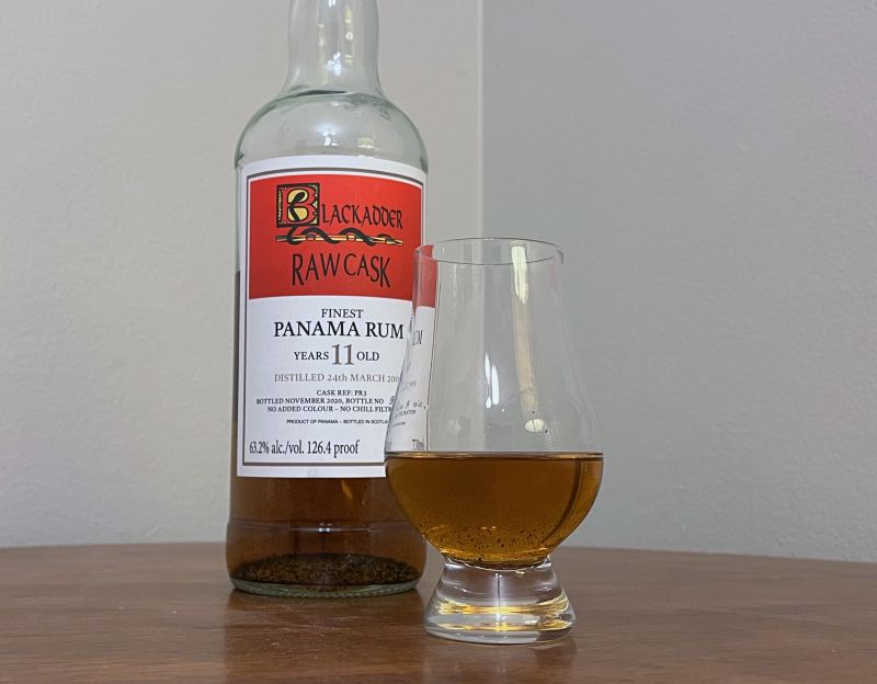 A bottle of Blackadder Raw Cask Panama 2009 next to a glass of rum