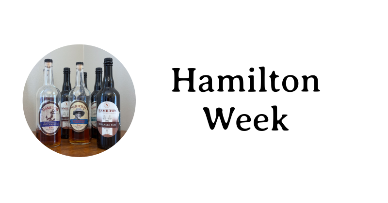 Hamilton Week text next to a number of Hamilton rum bottles