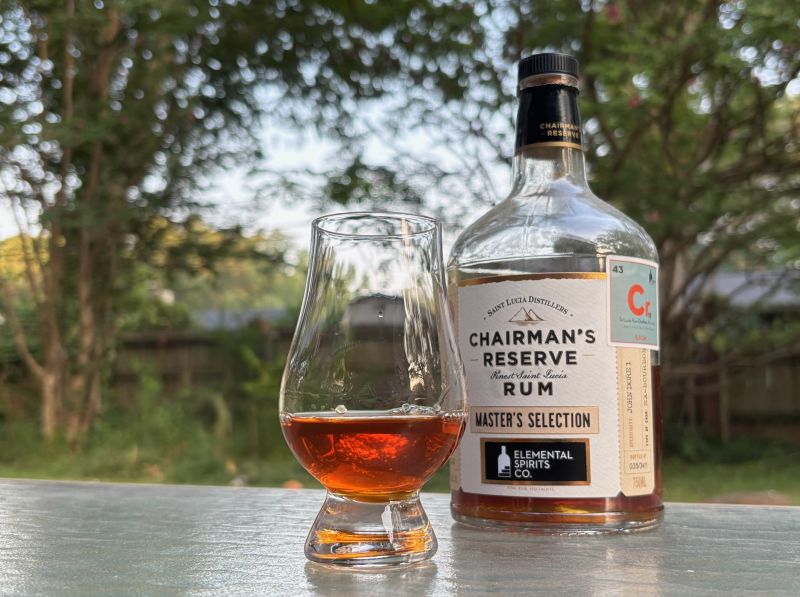 A bottle of Chairman's Reserve Single Cask - Elemental Spirits Co. 19 year next to a glass of rum