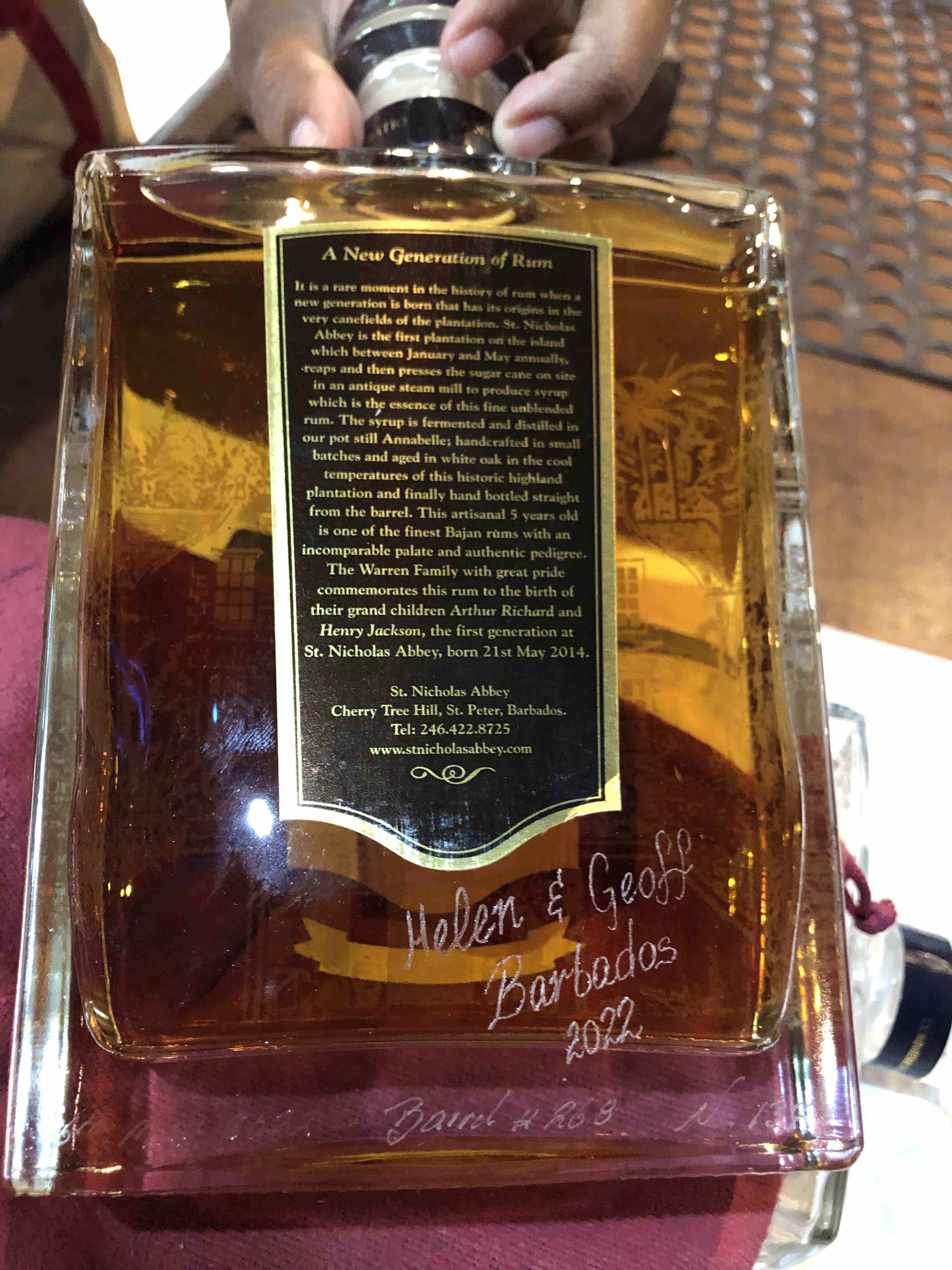 Engraving on a rum bottle reading 'Geoff and Helen, Barbados 2022'