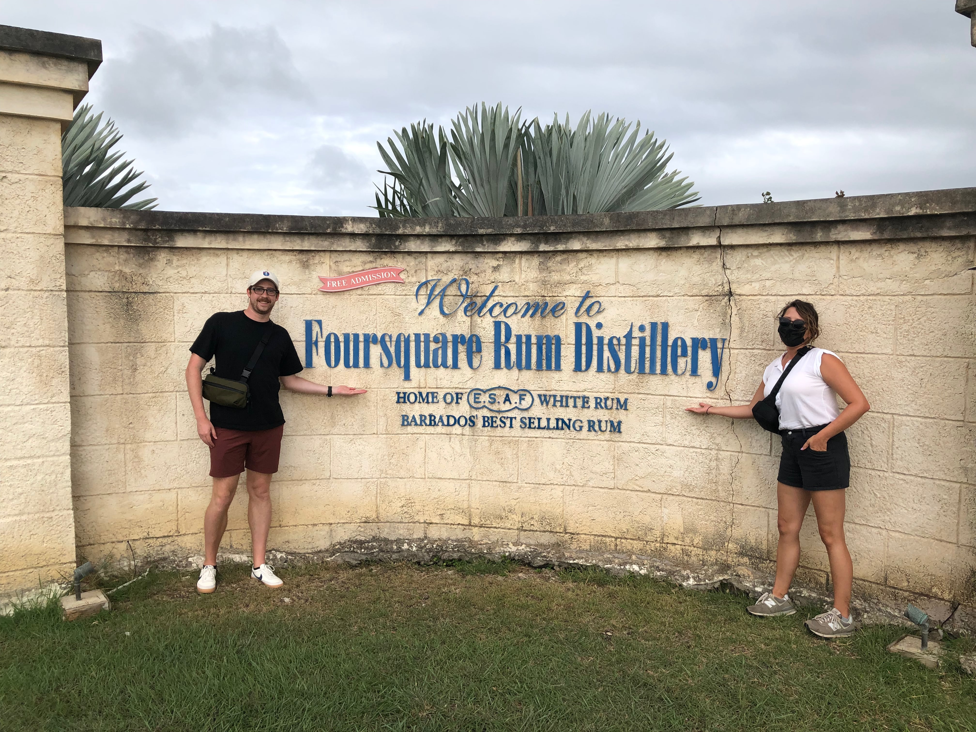 Geoff and Helen in front of the Foursquare Rum Distillery sign