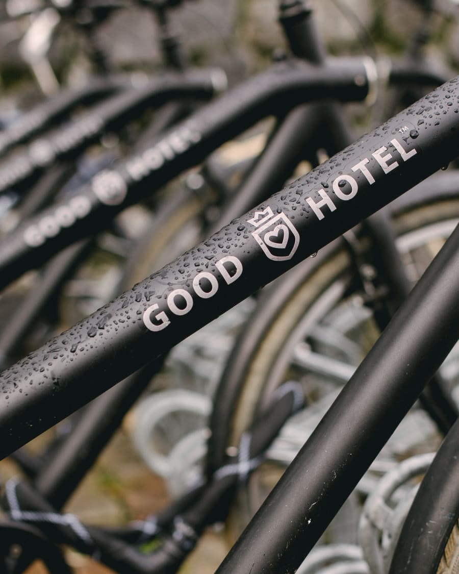 A rack of black bikes from Good Hotel in Amsterdam