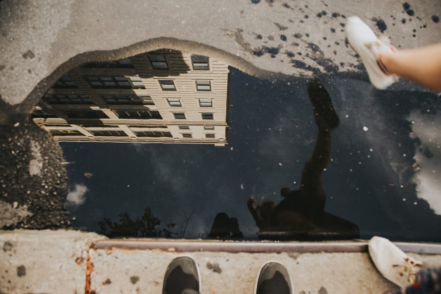 Reflection of a building in a puddle