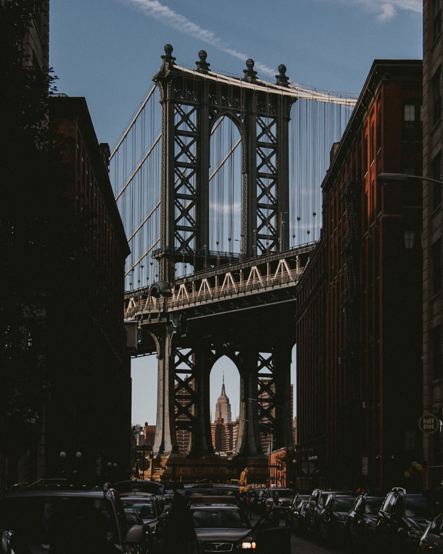 A view of the Empire State building framed by the arch of Manhattan Bridge taken from Washington Street in Dumbo, Brooklyn