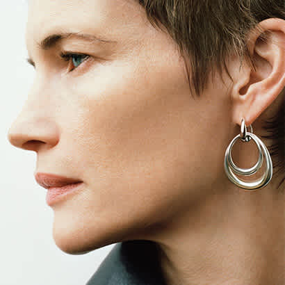 stackable earrings in sterling silver on model from the offspring collection by georg jensen