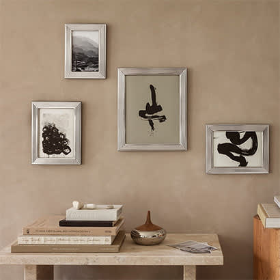 bernadotte picture frames small, medium and large in stainless steel and glass on a wall