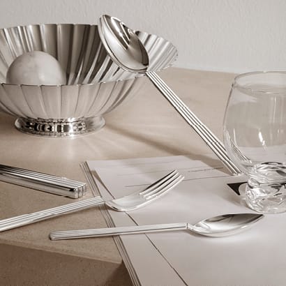 Cutlery and bowl in sterling silver designed by Sigvard Bernadotte