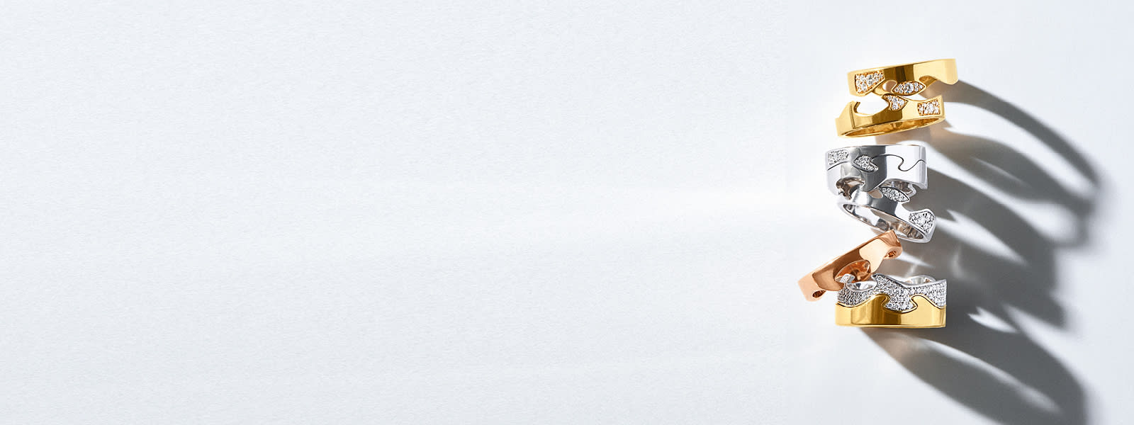 Rings in 18 kt yellow gold, rose gold, and white gold and diamonds designed by Nina Koppel for the Fusion collection. 