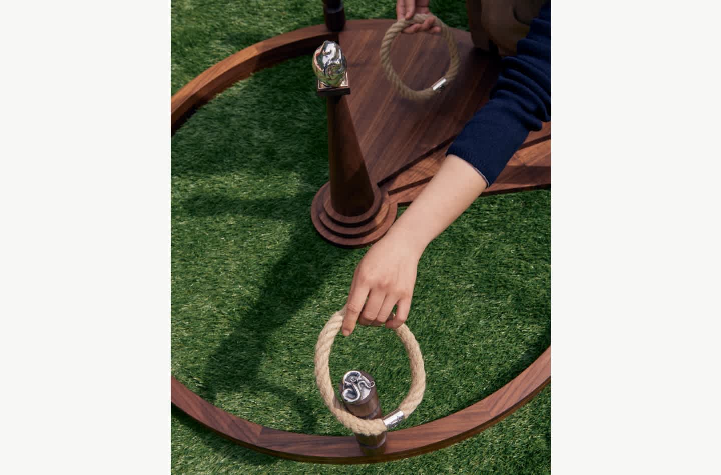 Ring toss game in walnut wood and silver by Georg Jensen at 3 Days of Design.