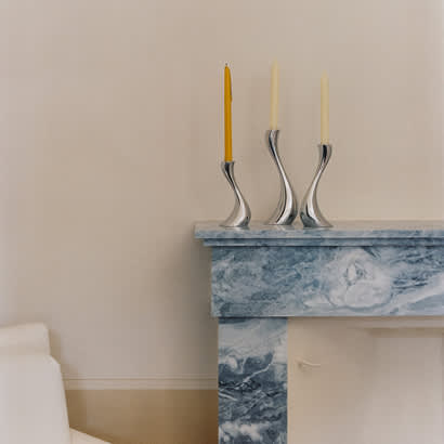 Mirror polished stainless steel candle holders from the Cobra collection