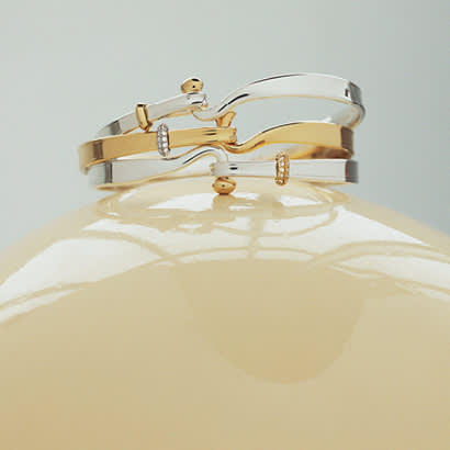 Bracelets in sterling silver, 18 kt gold and diamonds from Torun Collection
